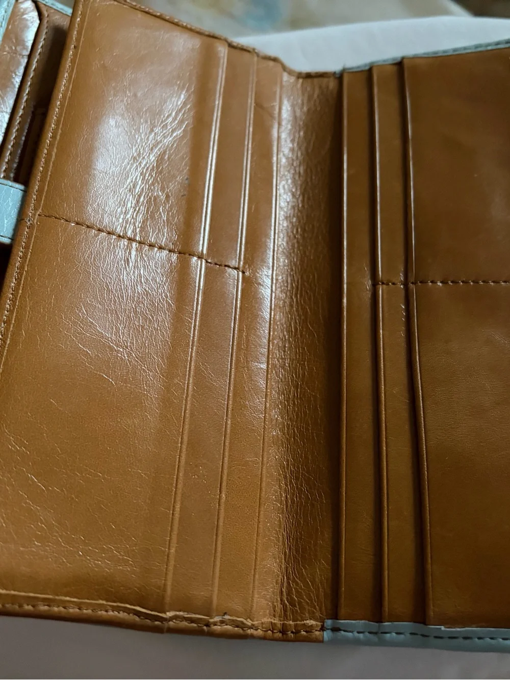 HOBO light blue leather wallet with brass hardware